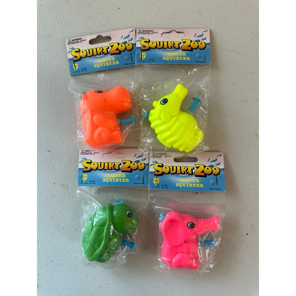 NIP Vintage 1991 Set Of 4 Squirt Zoo Water Squirter Hard Plastic Water Gun